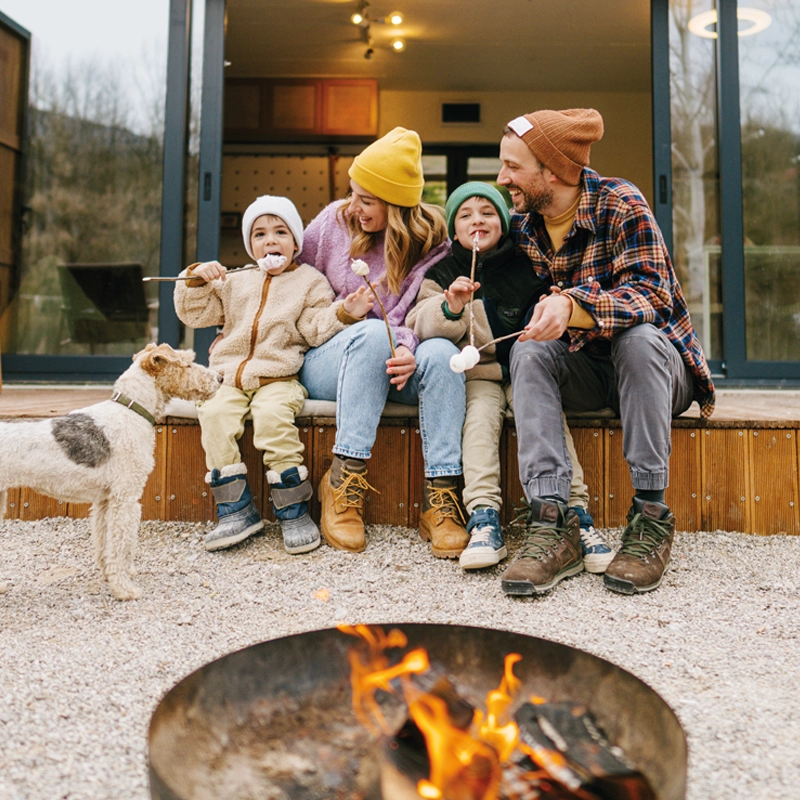 family-sitting-around-a-fire-800x800.webp