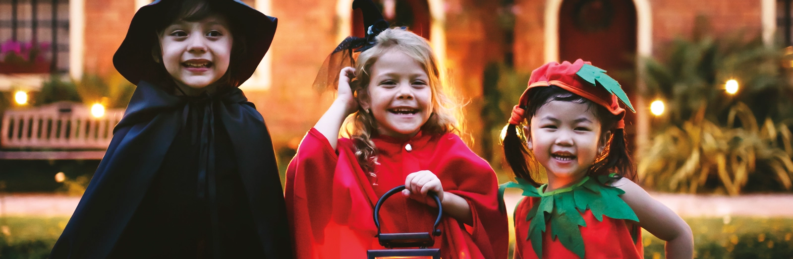 kids-in-costumes-trick-or-treating-1600x522.webp