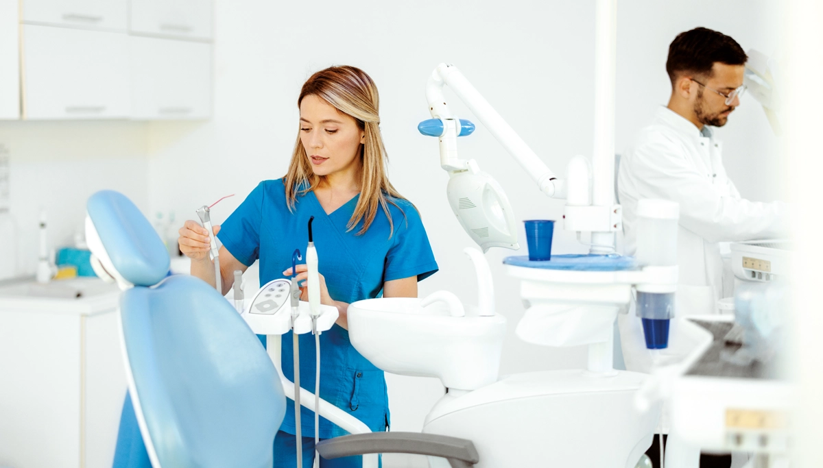 dentist-and-hygienist-prepping-for-appointment-1200x683.webp