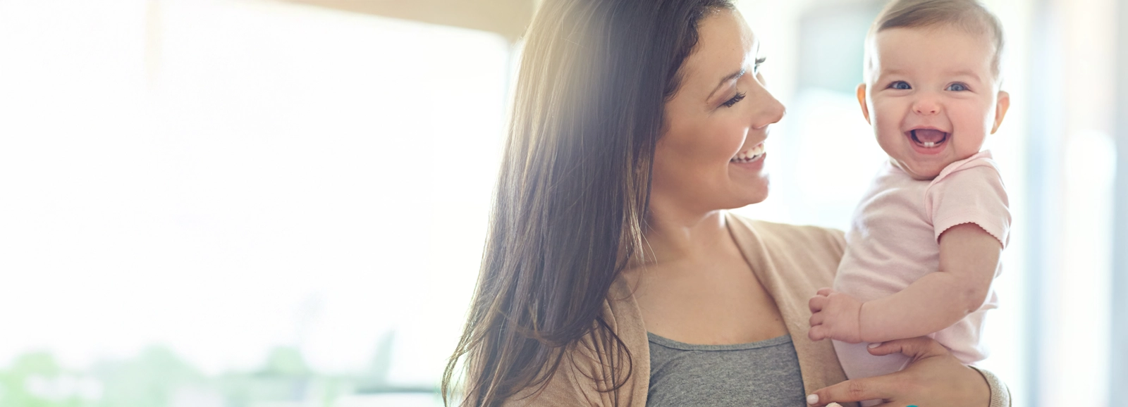 mom-and-baby-laughing-together-1600x578-ALT.webp